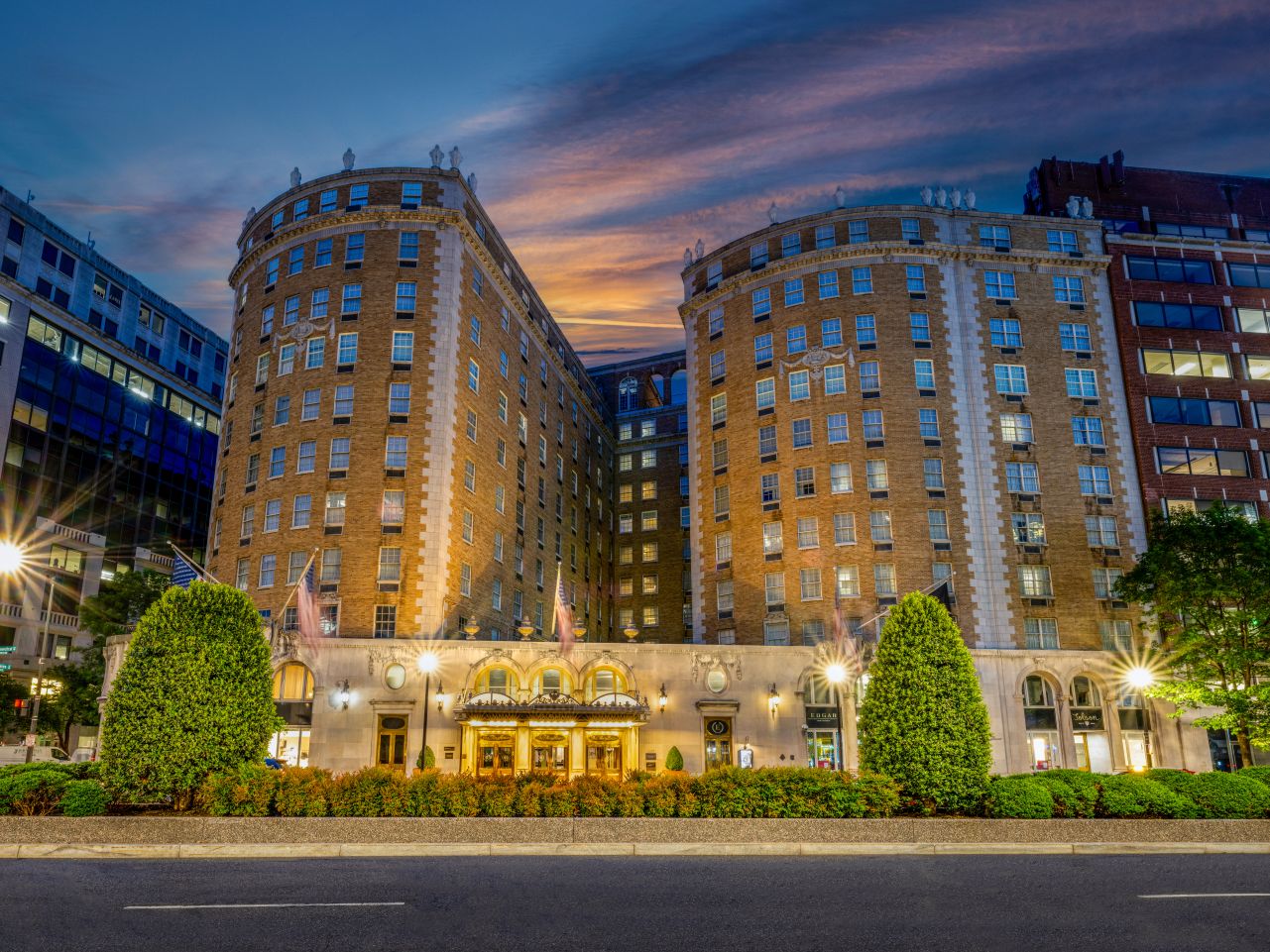 Exterior of Marriott Vacation Club timeshare at The Mayflower Washington, DC with landscaped boulevard in foreground